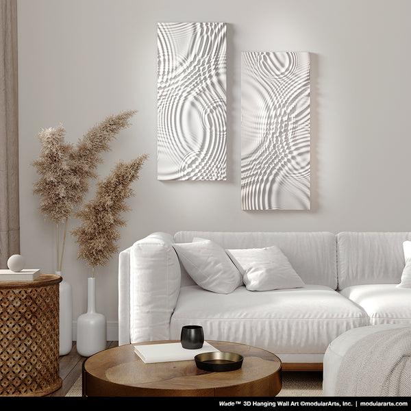 Modern living room with white sofa, wooden coffee table, and decorative wall art.